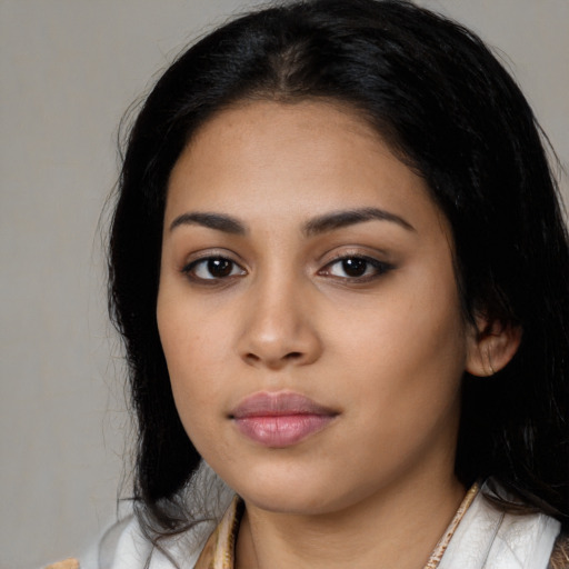 Neutral latino young-adult female with long  black hair and brown eyes