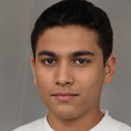 Neutral latino young-adult male with short  brown hair and brown eyes