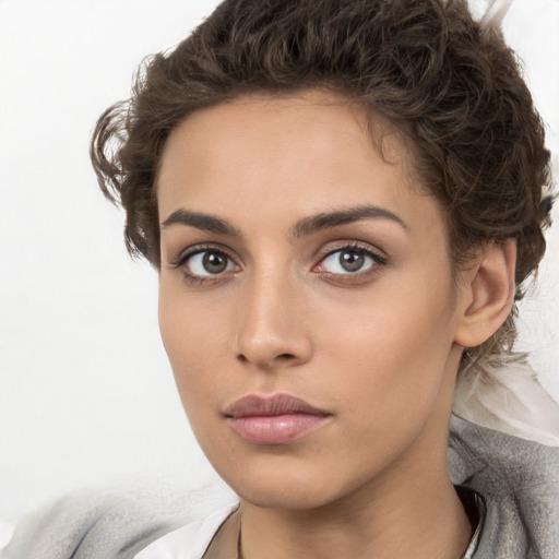 Neutral white young-adult female with medium  brown hair and brown eyes