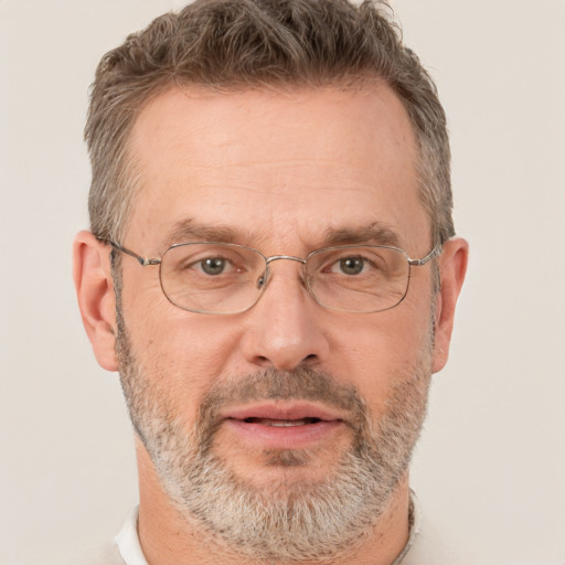 Joyful white middle-aged male with short  brown hair and brown eyes