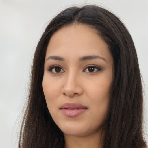 Neutral latino young-adult female with long  brown hair and brown eyes