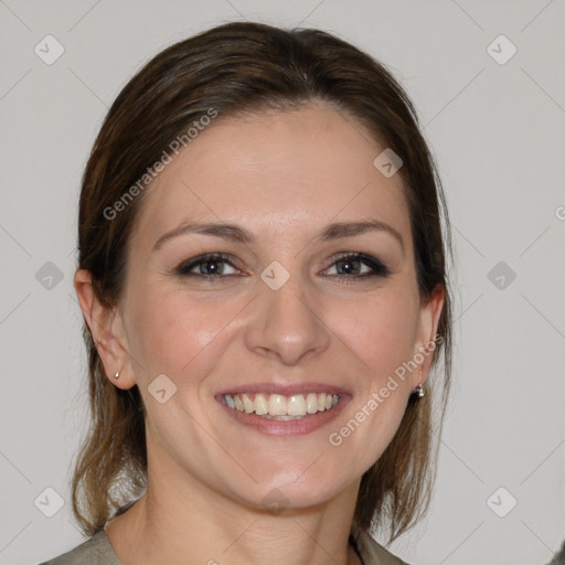 Joyful white young-adult female with medium  brown hair and grey eyes