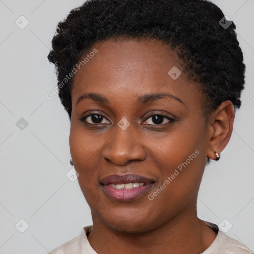 Joyful black young-adult female with short  black hair and brown eyes