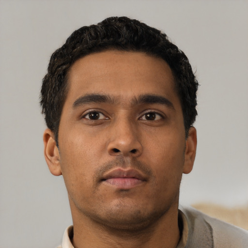 Neutral latino young-adult male with short  black hair and brown eyes