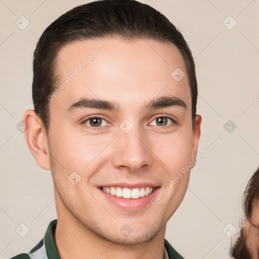 Joyful white young-adult male with short  brown hair and brown eyes