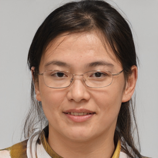 Joyful white adult female with medium  brown hair and brown eyes