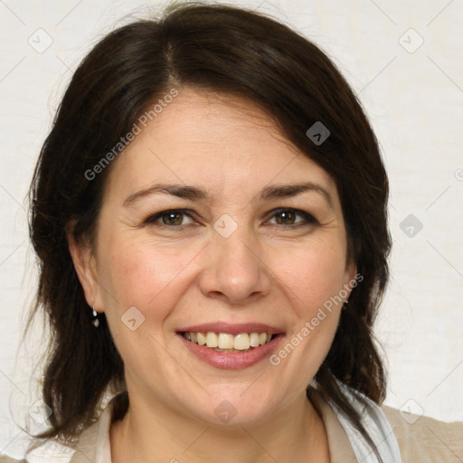 Joyful white adult female with medium  brown hair and brown eyes