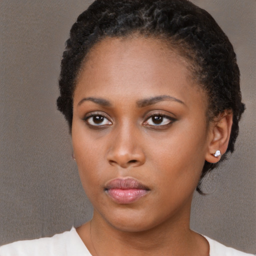 Neutral black young-adult female with short  black hair and brown eyes