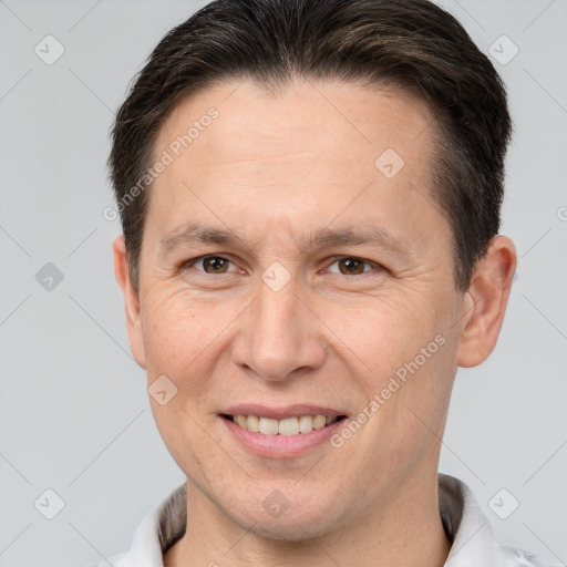 Joyful white adult male with short  brown hair and brown eyes