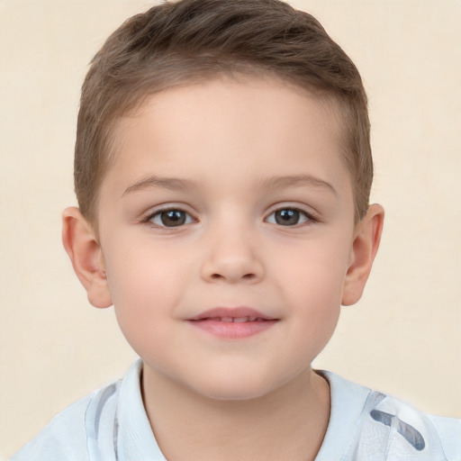 Joyful white child male with short  brown hair and brown eyes