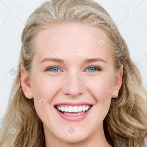 Joyful white young-adult female with long  brown hair and blue eyes