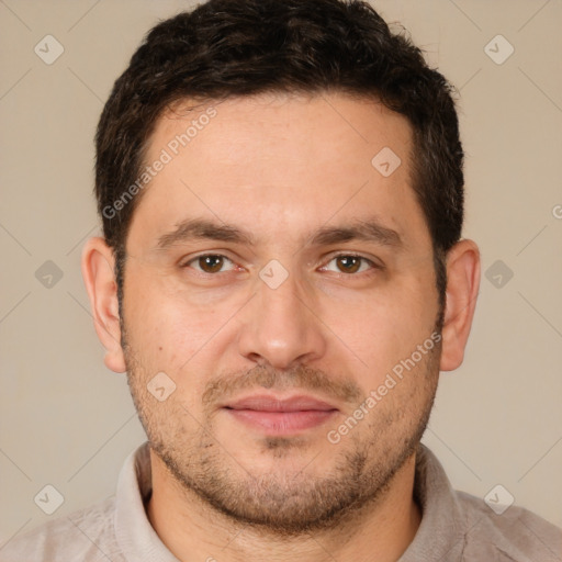 Joyful white adult male with short  brown hair and brown eyes