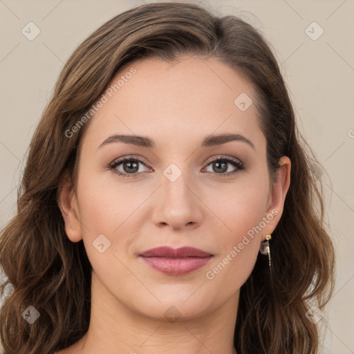 Joyful white young-adult female with long  brown hair and green eyes