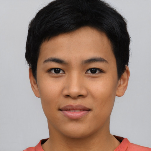 Joyful asian young-adult male with short  black hair and brown eyes