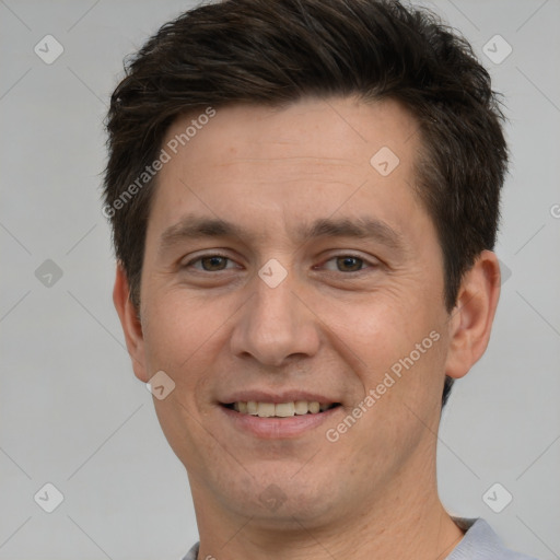 Joyful white adult male with short  brown hair and brown eyes