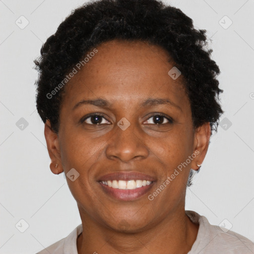 Joyful black adult female with short  brown hair and brown eyes