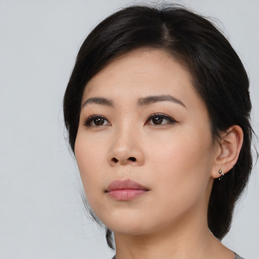 Neutral asian young-adult female with medium  black hair and brown eyes