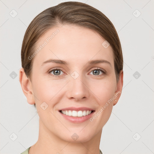 Joyful white young-adult female with short  brown hair and grey eyes