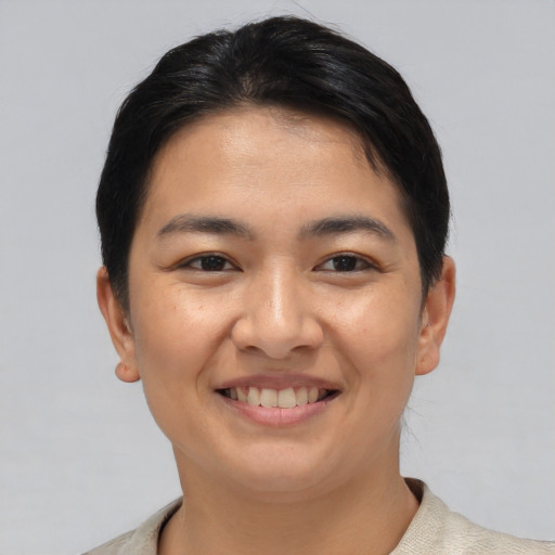Joyful asian young-adult female with short  black hair and brown eyes