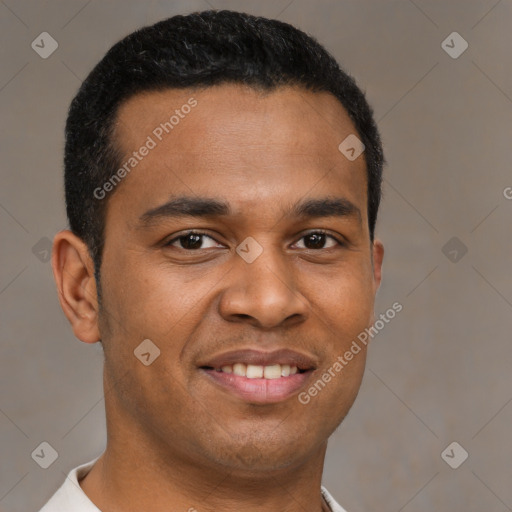 Joyful latino young-adult male with short  brown hair and brown eyes