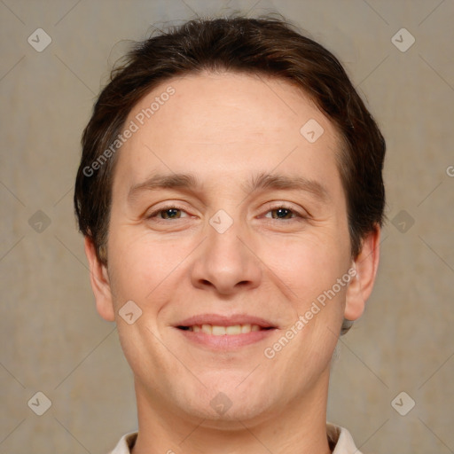 Joyful white adult male with short  brown hair and brown eyes