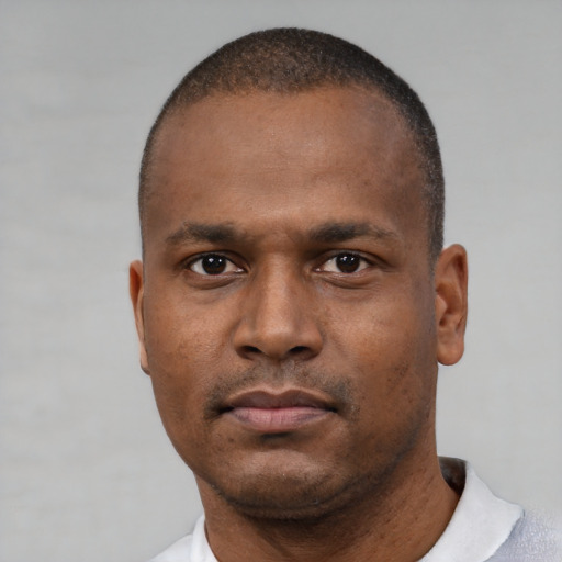 Neutral black young-adult male with short  black hair and brown eyes