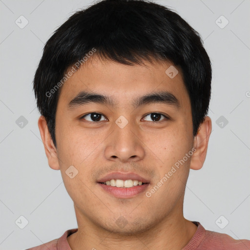 Joyful asian young-adult male with short  brown hair and brown eyes