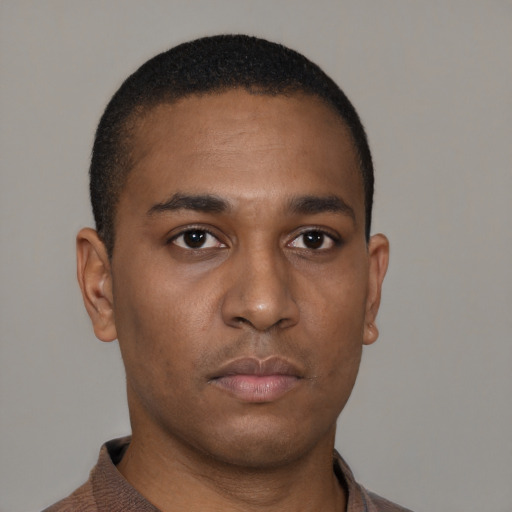 Neutral latino young-adult male with short  brown hair and brown eyes