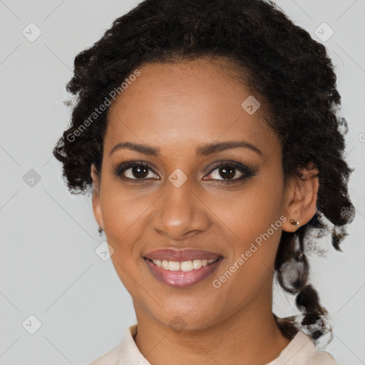 Joyful black young-adult female with medium  brown hair and brown eyes