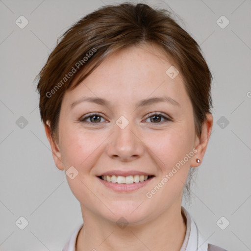 Joyful white young-adult female with short  brown hair and grey eyes