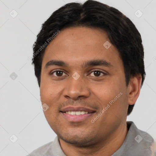 Joyful white young-adult male with short  black hair and brown eyes