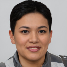 Joyful asian young-adult female with short  brown hair and brown eyes