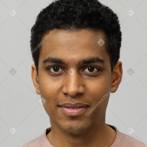 Joyful black young-adult male with short  black hair and brown eyes