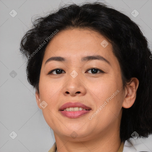 Joyful asian adult female with medium  brown hair and brown eyes