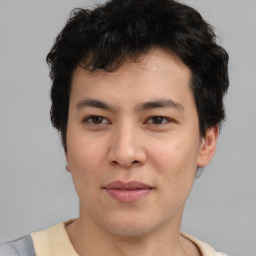 Joyful asian young-adult male with short  brown hair and brown eyes