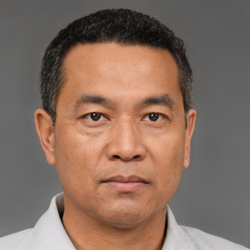Neutral asian adult male with short  black hair and brown eyes