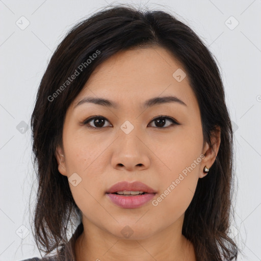 Joyful asian young-adult female with long  brown hair and brown eyes