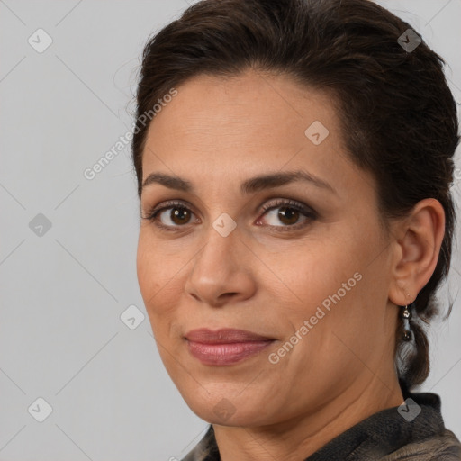 Joyful white adult female with medium  brown hair and brown eyes