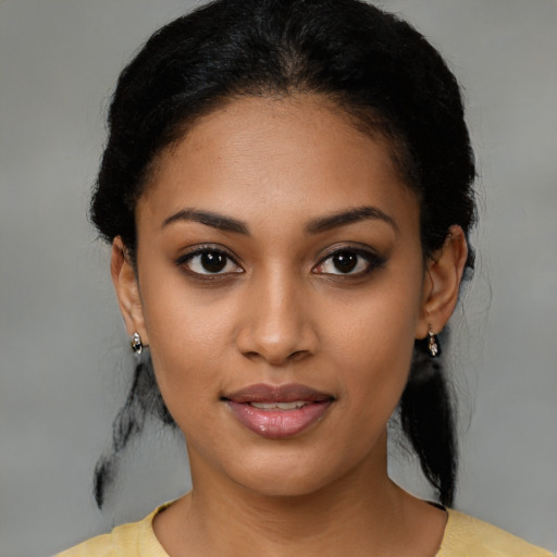 Joyful latino young-adult female with medium  black hair and brown eyes