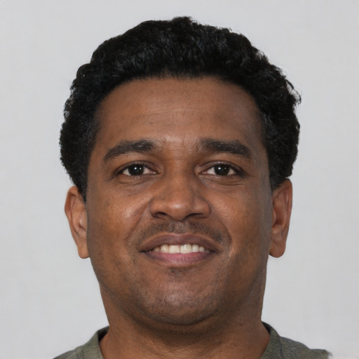 Neutral latino adult male with short  black hair and brown eyes