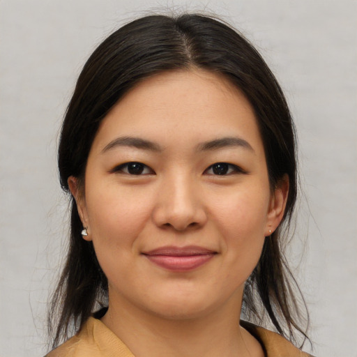 Joyful asian young-adult female with medium  brown hair and brown eyes