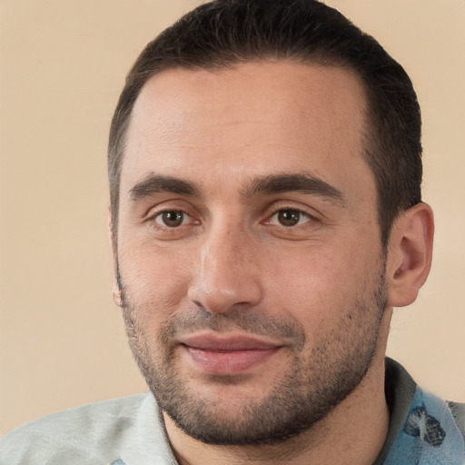 Joyful white young-adult male with short  brown hair and brown eyes