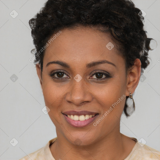 Joyful black young-adult female with short  brown hair and brown eyes