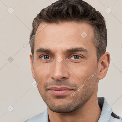 Neutral white young-adult male with short  brown hair and brown eyes