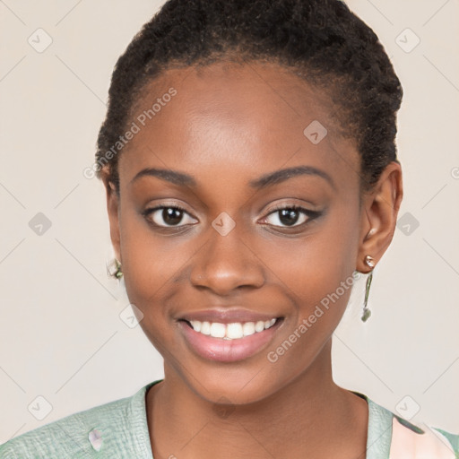 Joyful black young-adult female with short  brown hair and brown eyes