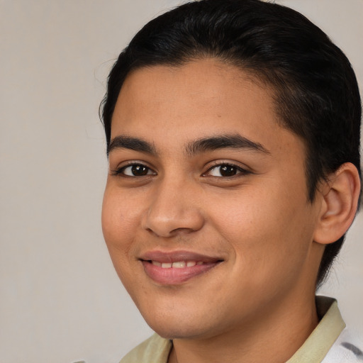 Joyful latino young-adult female with medium  brown hair and brown eyes