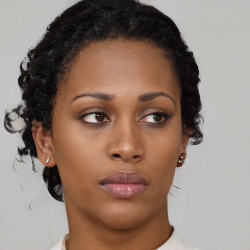 Neutral black young-adult female with short  brown hair and brown eyes