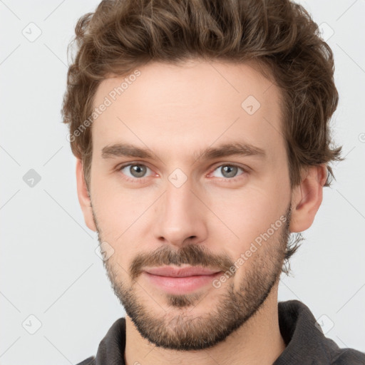 Neutral white young-adult male with short  brown hair and grey eyes