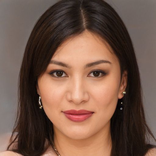 Joyful white young-adult female with long  brown hair and brown eyes