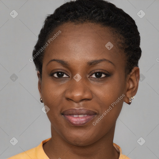 Joyful black young-adult female with short  black hair and brown eyes